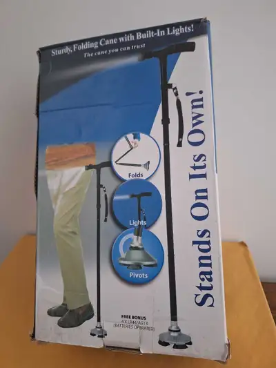 Folding adjustable cane  NEW, View more