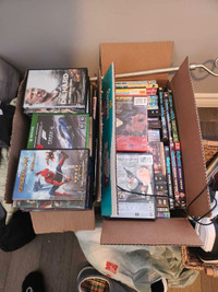 Two boxes of dvds and videos games