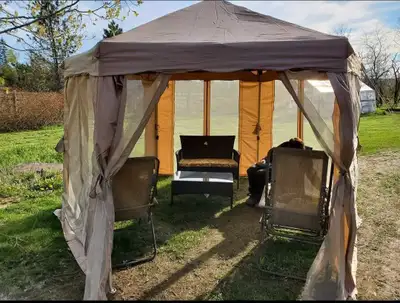 XLARGE gazebo and furniture. ASJUSTABLE TO 12 FEET 2 chairs 1 table with glass top 2 bamboo lounging...