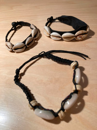 Three South African shell and leather bracelets, $5 each