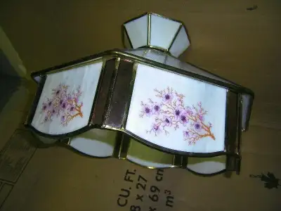 Selling a beautiful tiffany style ceiling light in good working condition. It's size is 12" H X 15"...