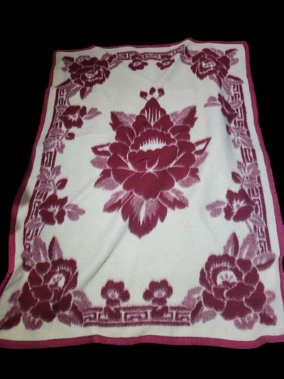Red & cream floral design thick fuzzy throw blanket. Home decor. Location - Farm house basement sout...