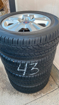 215/55R16 BRIDGESTONE TURANZA all season tires on SAAB alloys