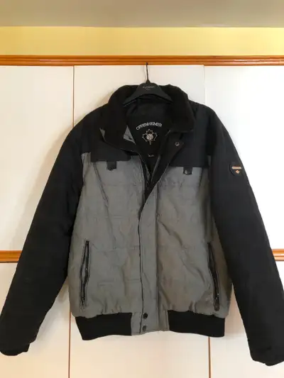 I am selling a Men's black & grey winter jacket that is in excellent condition except for the right...