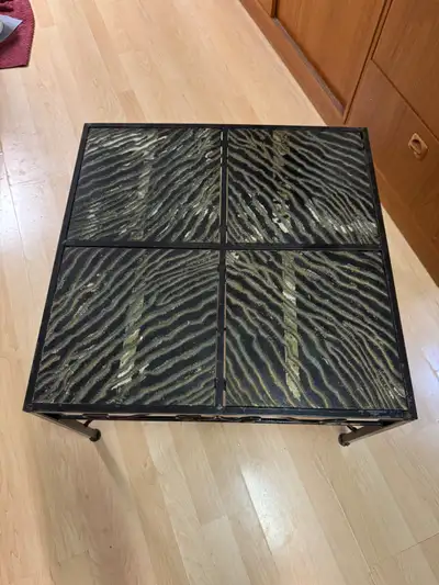 25.5 inches squared, 16 inches tall. Solid metal. Four tiles that can be rearranged to whichever pat...