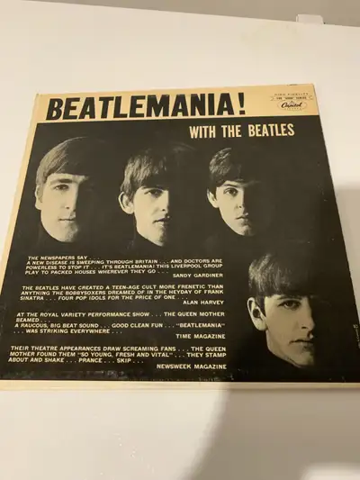 Relive the Beatlemania era with this classic vinyl record, "Beatlemania! With the Beatles." This vin...