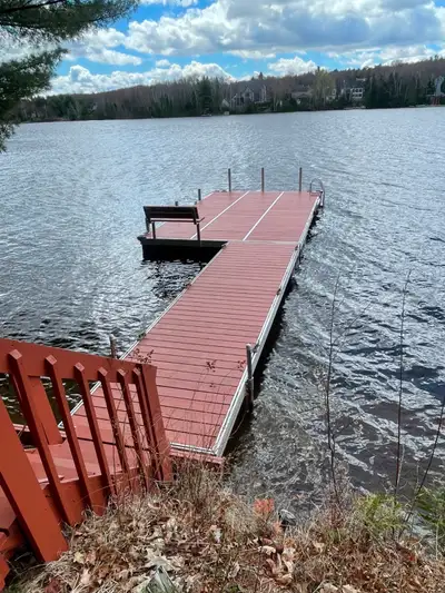 Floating dock. Made of wood, with aluminum siding on floats. Bench and Ladder for swimming. 40 feet...