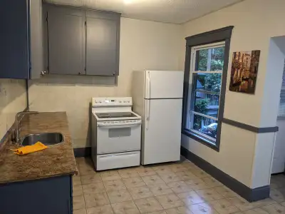 large and spacious 1 bdrm apartment is a detached home, all utilities included, laundry and 1 parkin...