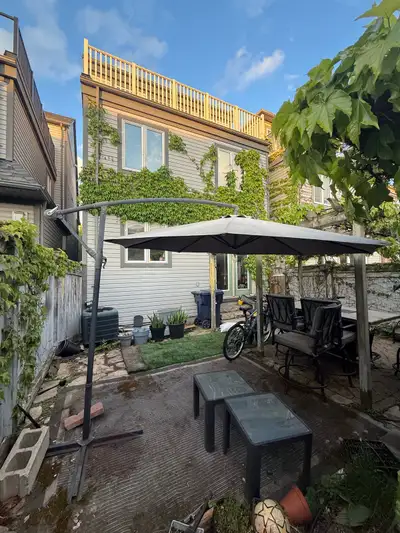 Large offset (cantilever) patio umbrella in excellent working condition. This modern hanging umbrell...