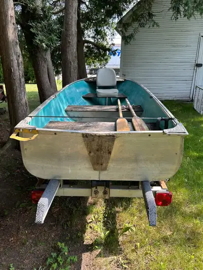 Trailer has new lights, tires, fenders and winch. No leaks. Comes with two oars. Text 2 8 9 7 1 6 5...