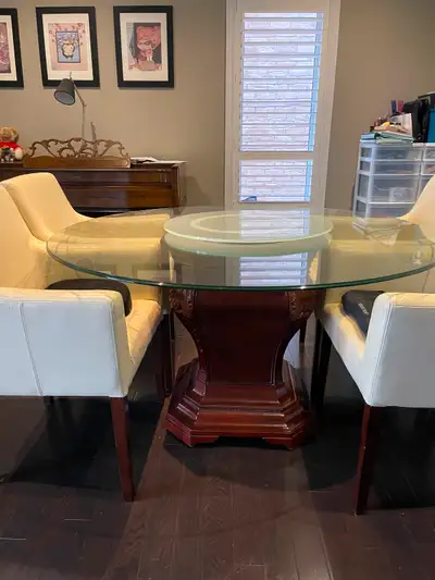 Selling 54” Elegant round dining table with a thick glass top and 24” glass turntable. Sturdy, decor...