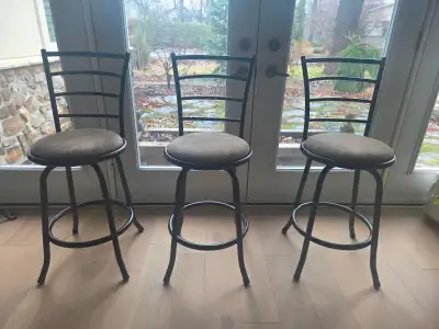Three wrought-iron swivel bar stools in excellent condition. All 3 swivel. Height 97cm/38 inches.