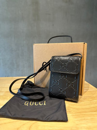 Gucci GG embossed leather crossbody 