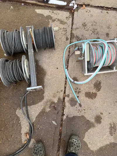 2 welding cable reels( one has 100ft& the other has about 80ft) remote reel has 100 ft and was set u...