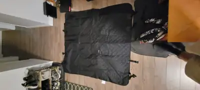 I don't have any animals but this came with my car when I bought it. Dimensions are 50"x55" Neoprene...