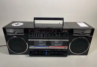 This vintage FISHER PH-W402 boombox combines AM/FM radio with a cassette tape deck for a retro liste...