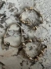 Pandora 14k gold bracelet with charms 