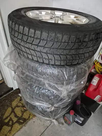 Set of 4 alloy rims and winter tires (rims are in great shape, tires need to be checked for use 235/...