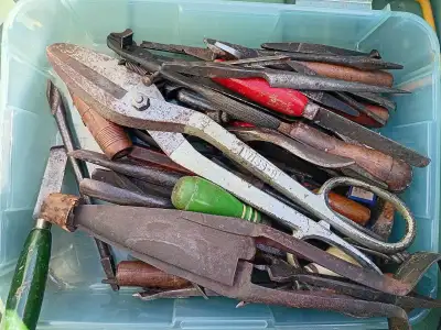 This lot of vintage tools includes various hand tools and metalworking implements, showing signs of...