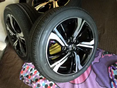 Honda Civic 215/50R17 Firestone FT140 all season tires on Honda Factory Alloy rims 5x114.3 bolt patt...