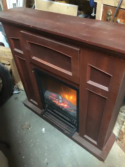 Electric fire place /heater Could fit in a corner of room if needed Asking 250$ o.b.o Contact me @ 8...