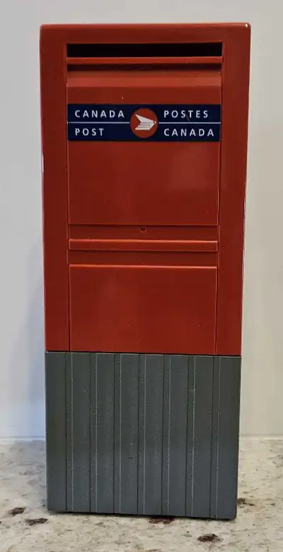 This Canada Post street mailbox coin bank is a charming find for collectors or anyone who loves a to...