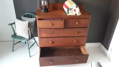 Beautiful antique dresser with mostly original knobs. Two top cast iron handles introduced later.