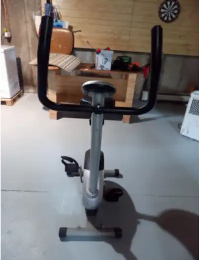 a stationary bike with tabs on calories burnt, speed and distance