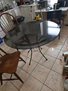 Glass table and 2 wood chairs nice for the kitchen., View more