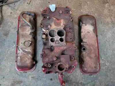 Located in Regina Stock 4 barrel intake and valve covers off an early 70s Big Block Chevy 454. Non-e...