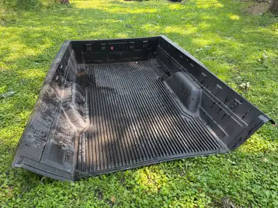 Durable black plastic bed liner. This slip-resistant liner has a ribbed floor design and is designed...