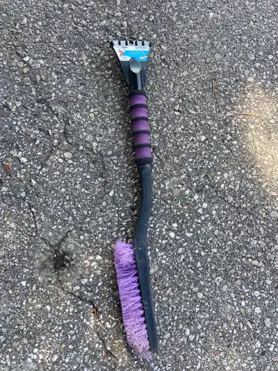 This is a used car ice scraper with a brush, perfect for clearing snow and ice from your vehicle dur...