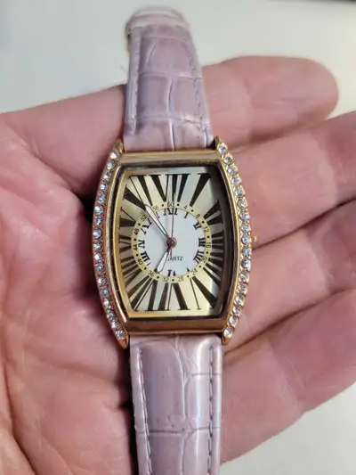 Ladies pink and gold tank style watch with diamond borders , View more