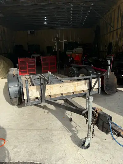 Heavy duty utility trailer with ramps. Dual 5000lb axles, 4 new tires. Wiring and brakes in excellen...