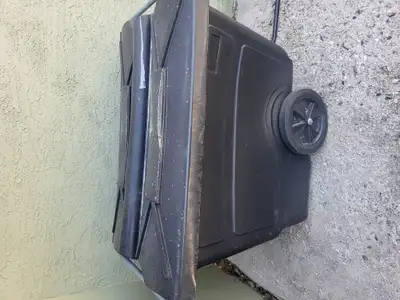 Large polyurethane black bin for yard or construction on wheels and lids,asking $100 , check out new...