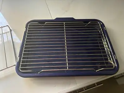 Broiler pan for sale: Includes drip rack, cooling rack underneath and the pan. The pan measures 18"...