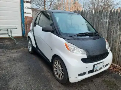 2010 Smart car for 2. New transmission actuater. New alternator. New battery. Needs tires and possib...