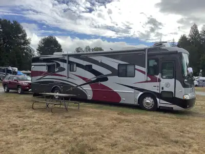 Well maintained 40 ft. Coach. Low mileage, 55000 miles. 4 slide outs. 400 HP Cummins Diesel. Freight...