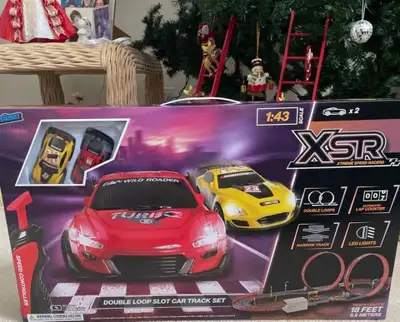 NEW XSR double loop slot car track set, featuring two 1:43 scale cars, a narrow track with double lo...
