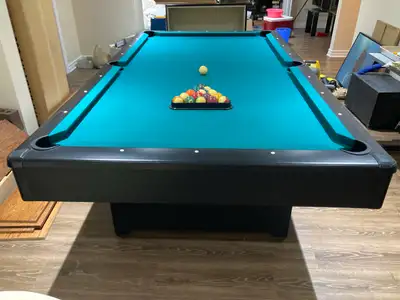 Brunswick pool table with accessories, as to the photos. Approximately 44" x 88" playing surface. Bu...