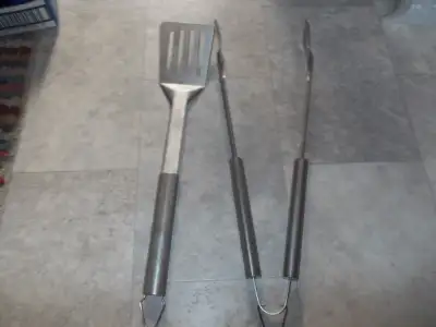 Two sets of stainless steel BBQ SETS. . One set has stainless/black handles--3 piece never been used...
