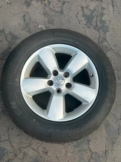 Selling a full set of original RAM 1500 alloy wheels with brand new all-season tires (285/60R20). Ti...