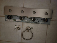 Nickel finish lights, handtowel holder, a hook for towel shower