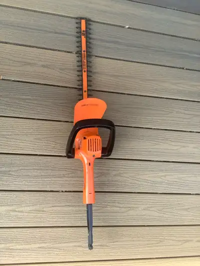 I'm offering a Black and Decker electric hedge cutter with a 16-inch blade, perfect for maintaining...