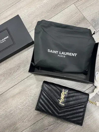 Selling a stunning, like-new YSL purse that exudes sophistication and style. This elegant purse feat...