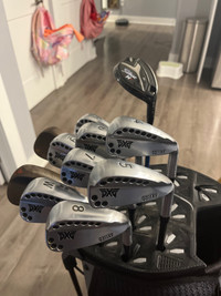 PXG 0311XF irons + driver , titleist 818 hybrid and bikes wedges