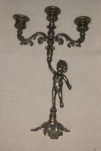 Brass cherub three stemmed Italy candle holder.