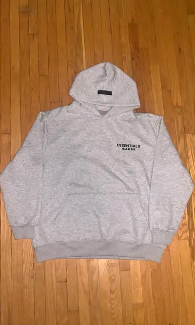 Grey ESSENTIALS hoodie in good condition , View more