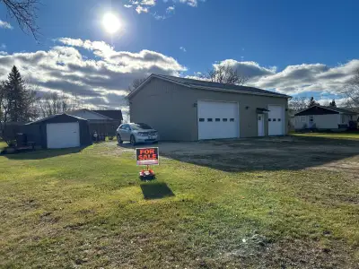 Cozy home on .52 Acre with large shop in the town of Richer, corner of Dawson Rd & PR 302. Well-main...