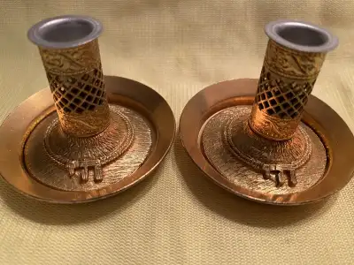 This is a very decorative and ornate set of mini candle holders that are goldish they are not stampe...